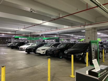 Enterprise Exotic Car Collection at Miami Airport including Maserati, Tesla, Porsche, and 