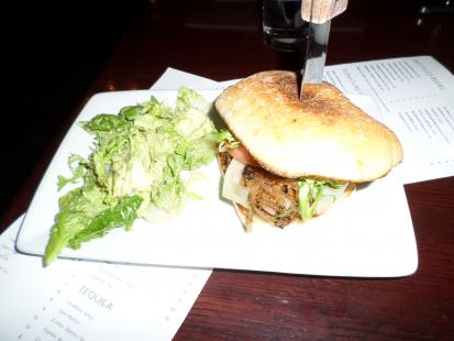 Tabla Restaurant has a great burger for $12. Cooked well without being burnt on the outsid
