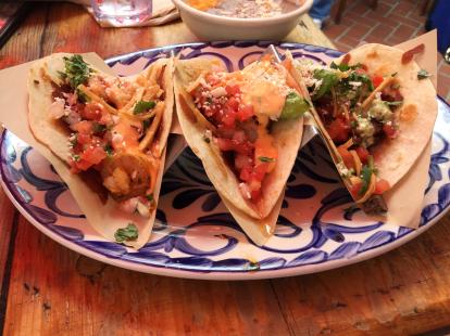 Tres Amigos taco including shrimp, lobster, and carne asada at Rockin Baja Lobster Coastal
