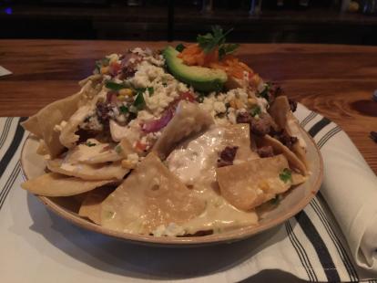 OpenNote: Smoked brisket nachos at Stonewood. Lots of cheese and a bit spicy. $12 #food