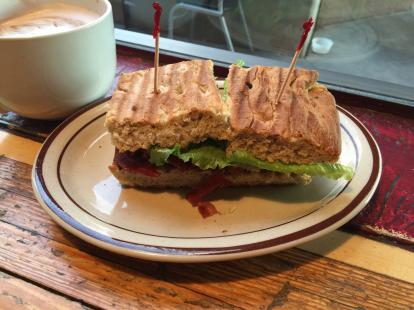 Bacon lettuce tomato sandwich at Cafe Milagro with coconut flavored cappuccino. Crispy bac