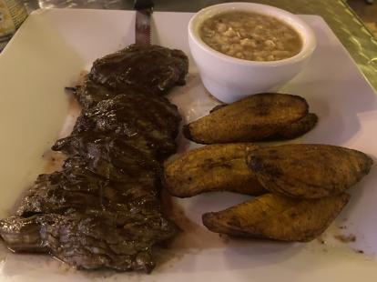 Beef steak with fried plantains and white beans. #food at El Tayta on the Beach $17