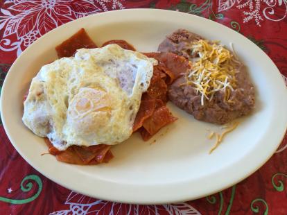 Chilaquiles at Bravos Cafe in Mesilla New Mexico $4 with lemonade. Egg on top of choppe to