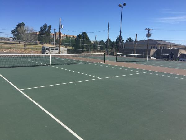 Four tennis courts at Memorial Park with lights.
