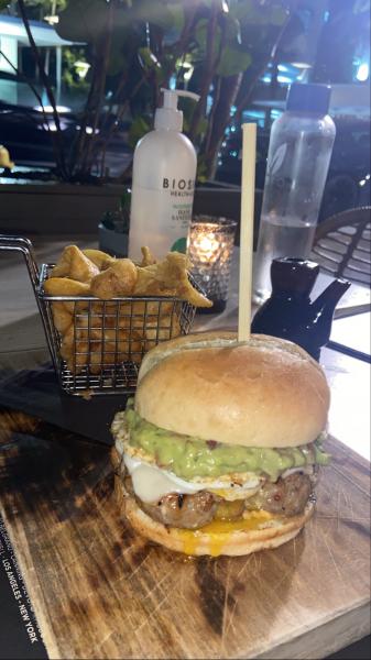 Tex Mex burger at Negroni Midtown . Topped with an egg and guacamole. #food Excellent 2022