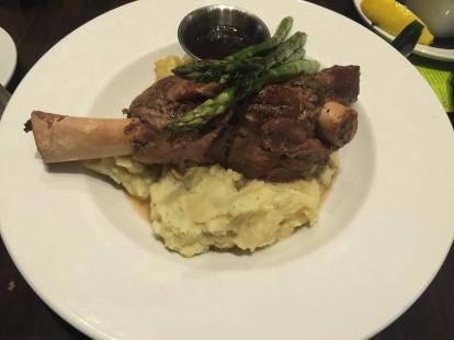 Lamb shank 18 oz served with mashed potatoes and grilled asparagus at Pecan Grill #food