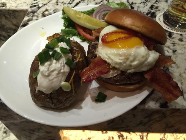Burger topped with an egg and bacon at Broken Arrow Tap House $12 better to order it well 