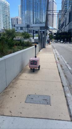 @tinymiledelivery small robot delivery vehicle on Brickell 2023