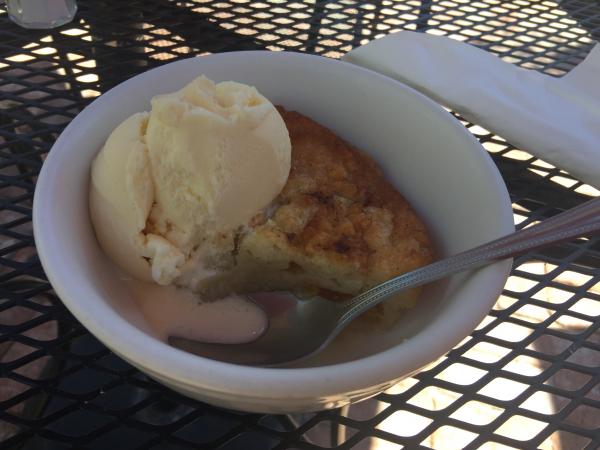 Outdoor dining at Josefina's Old Gate peach cobbler with ice cream. Excellent, a light