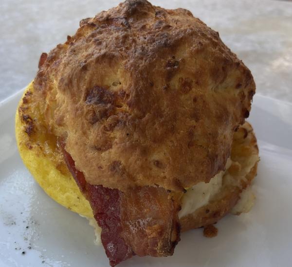 Breakfast sandwich with egg and bacon on a biscuit. #food $6.95 at Annâ€™s Florist an