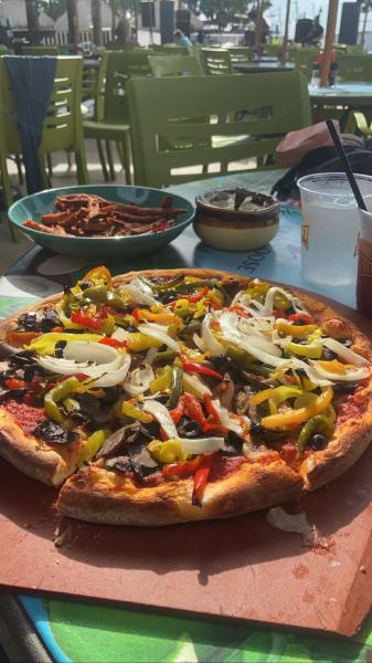 Jimmy Johnson’s Big Chill patio seating by the water Key Largo Florida 2022 Veggie pizza