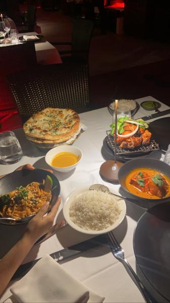 Jaia at the Setai. Clockwise from left. Shrimp Pad Thai, naan bread with sauce, chicken ti